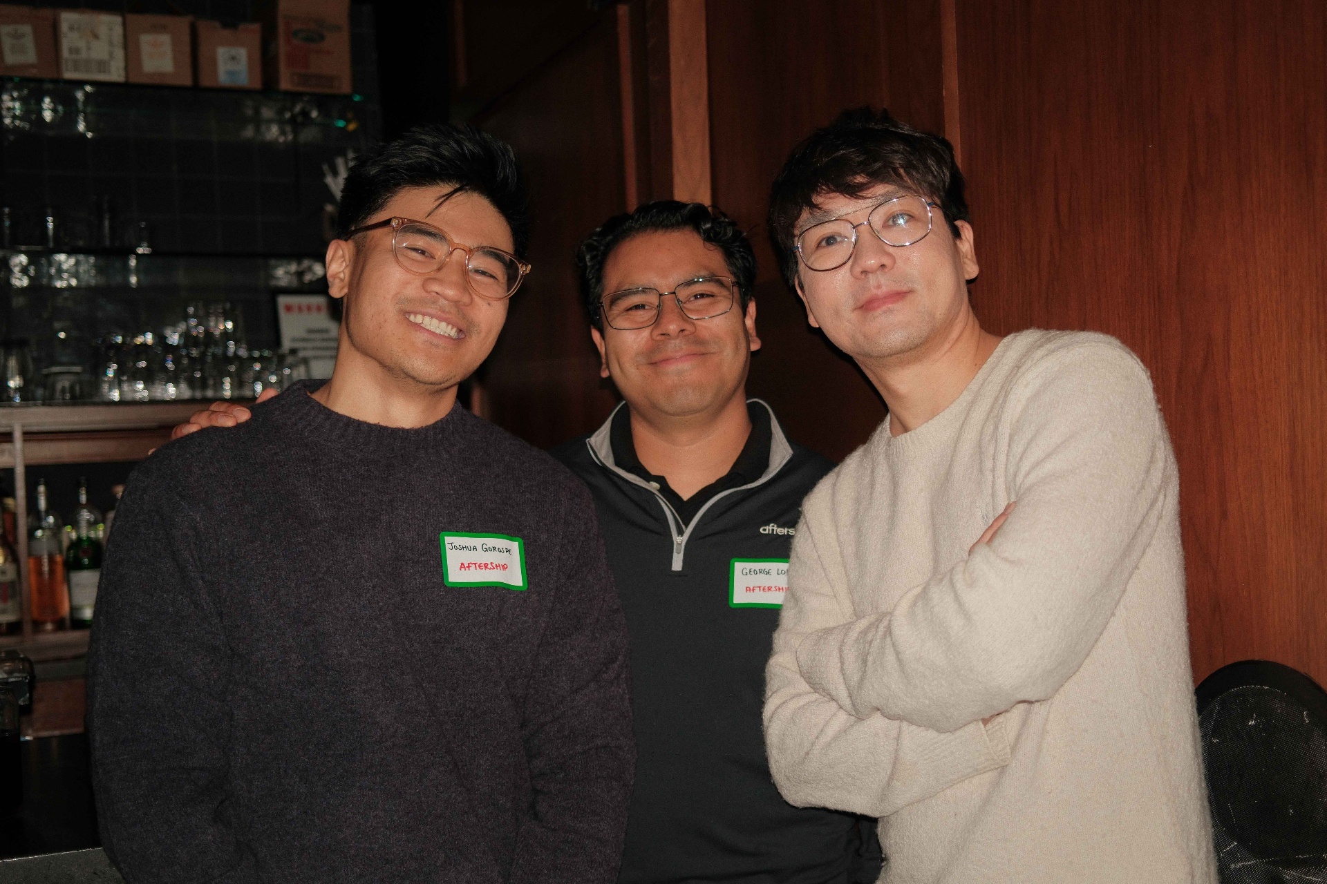 Three guests posing together at a CX and the City dinner